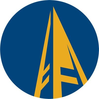 Schoolcraft College's company logo consists of a dark powdery blue background with a mustard yellow graphic of what appears to be a tall building. The angle shows the viewer at the bottom of the building.