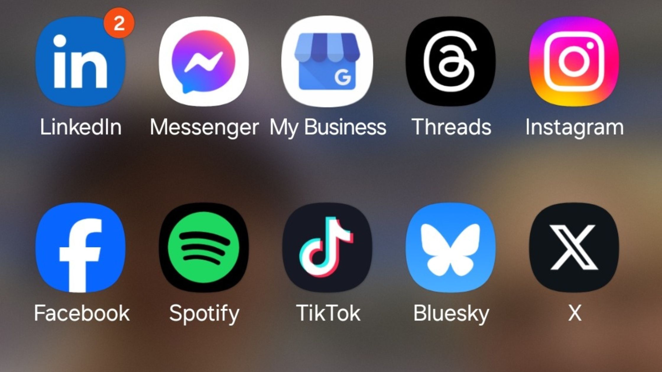 Different social media icons on a phone screen