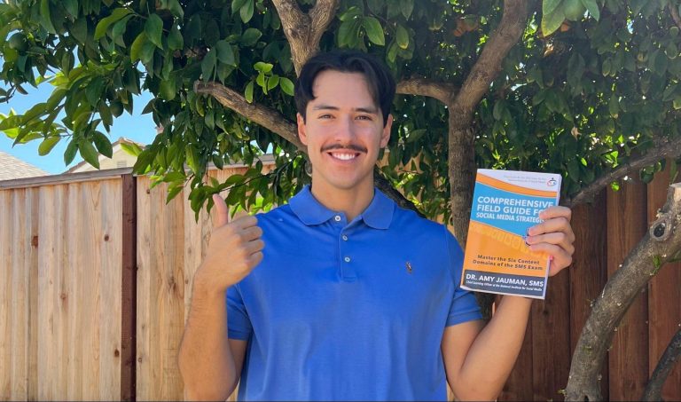 The featured image showcases Joseph Scalzo holding up his Comprehensive Field Guide for Social Media Strategists. He is giving a thumbs-up, wearing a blue polo, and standing in front of a wooden fence and an orange tree.