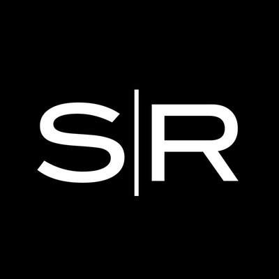 Shady Rays company logo consists of a black background with a bright white capitalized S and R. The S and R are divided bet a skinny, vertical white line.