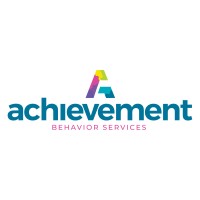 Achievement Behavior Services company logo consists of a white background with the pale-blue, lowercase text: achievement. Underneath is the pink, capitalized text: "BEHAVIOR SERVICES." Above the word "achievement" is a rainbow-colored capital A.