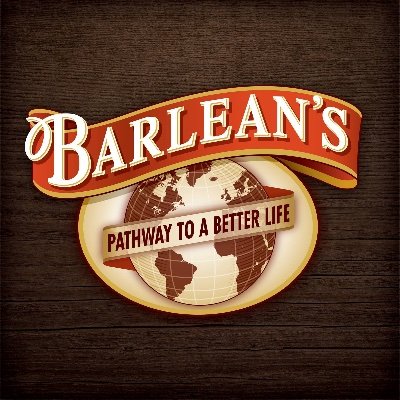 Barlean's Organic Oils' company logo consists of a brown, wooden background with the uppercase word "Barlean's" at the top. Underneath is the picture of a glove with the saying "PATHWAY TO A BETTER LIFE" going over it horizontally.