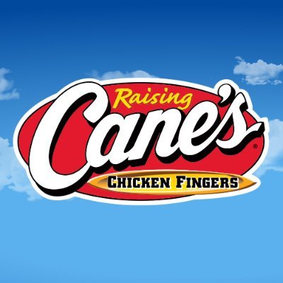 Raising Cane's Chicken Fingers' company logo consists of a blue sky background with the classic Raising Cane's Chicken Fingers company logo (yellow, white, and black lettering, inside of a red, horizontal oval.)