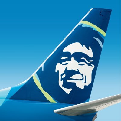 Alaska Airlines' company logo consists of the tail fin of an airplane with the white drawing of a smiling Inuit's face