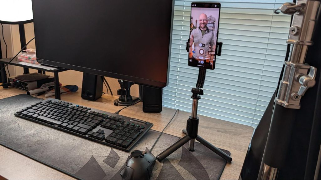 Selfie stick holding a smartphone