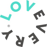 Lovevery's company logo consists of a white background and the text "Lovevery" wrapping around in a circle.