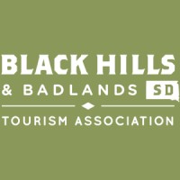 Black Hills & Badlands Tourism Association's company logo consists of a pastel green with the capitalized white words "Black Hills & Badlands Tourism Association."