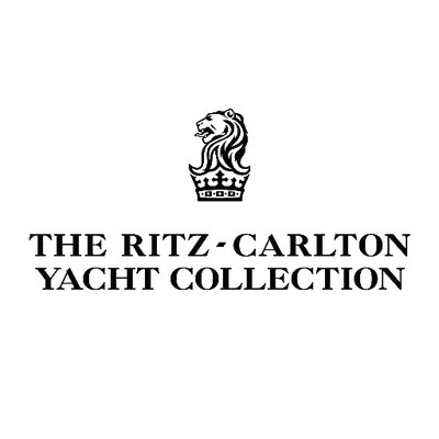 The Ritz-Carlton Yacht Collection's company logo consists of a white background with a lion's head over a king's crown, with the lack text "The Ritz-Carlton Yacht Collection" underneath it.