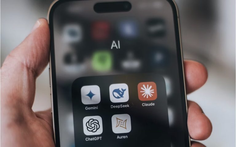 Someone holding smartphone with a screen that shows AI application icons.